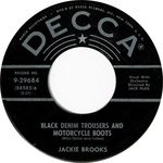 Jackie Brooks - Black denim trousers and motorcycle boots